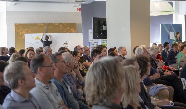 Mensen in zaal Atlas Werkconferentie 2019 